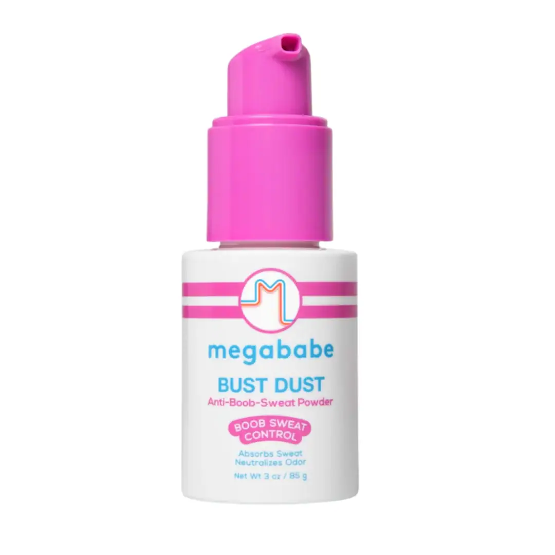 A white and pink bottle of Megababe Bust Dust anti-boob-sweat powder, labeled for sweat and odor control, with a pump dispenser.